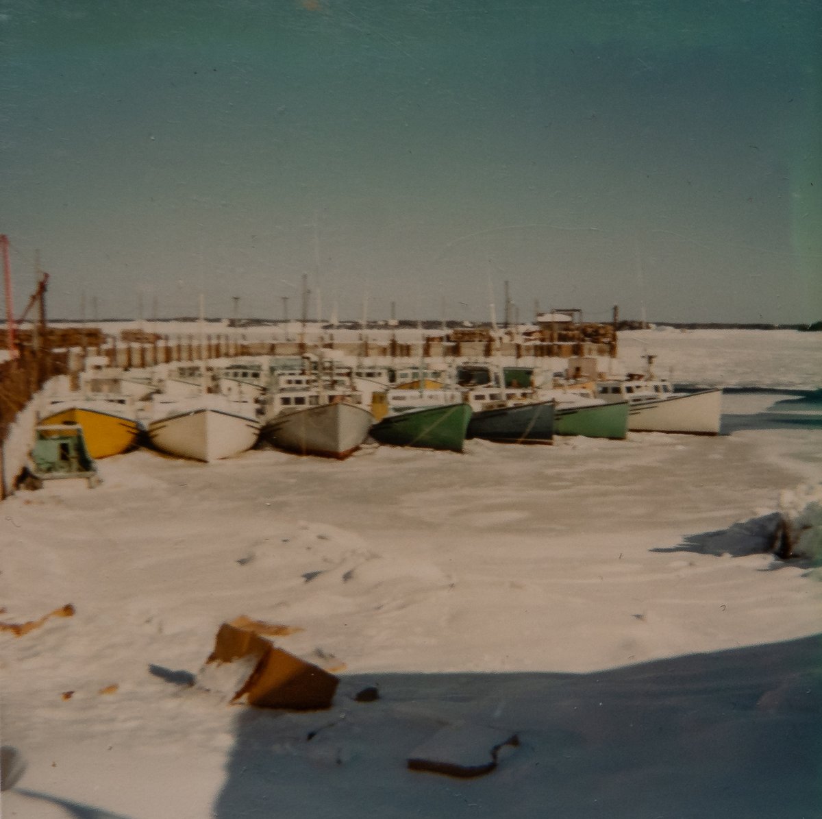 ImagesCoast's tweet photo. 1970 Newellton, Shelburne County, Nova Scotia, Canada Fishing boats iced in at the wharf.  #icedin https://t.co/sLPf3ul7xW