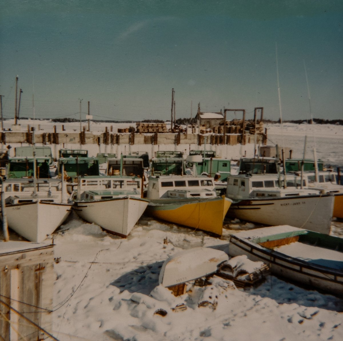 ImagesCoast's tweet photo. 1970 Newellton, Shelburne County, Nova Scotia, Canada Fishing boats iced in at the wharf.  #icedin https://t.co/sLPf3ul7xW