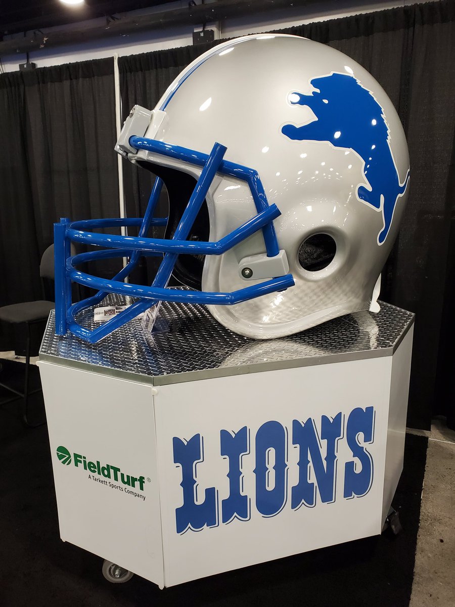 FieldTurf's tweet photo. Talk about making a GIANT impact at @WeAreAFCA #afca #afca2024 - Have you checked out the @Lions mega helmet by @GiantHelmet at the @FieldTurf booth? #footballcoach #athleticdirector #sportsmarketing #fundraising https://t.co/FVF9ZrJr6O