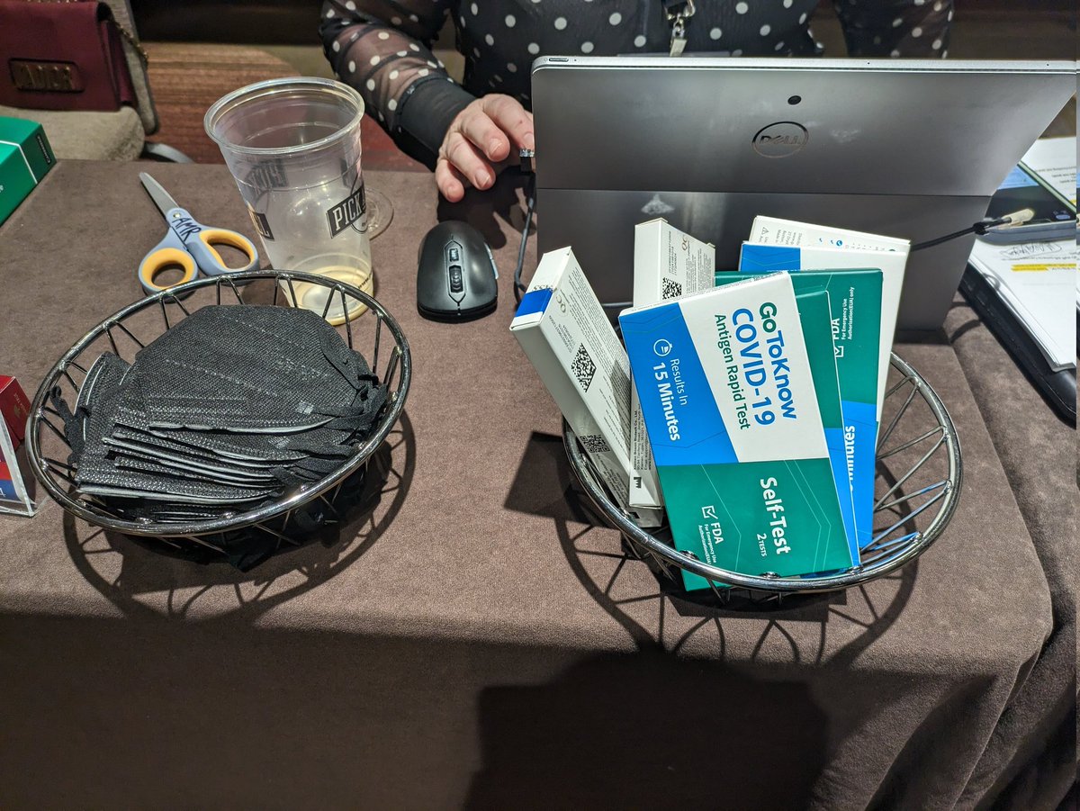 DisabldLinguist's tweet photo. Super happy to see so many masks at #LSA2024 and even happier today to notice this station at the help desk, with help desk workers masking!!! Be still my immune compromised heart ♥ #COVID19 #wearamask https://t.co/Sj1zWgOqff