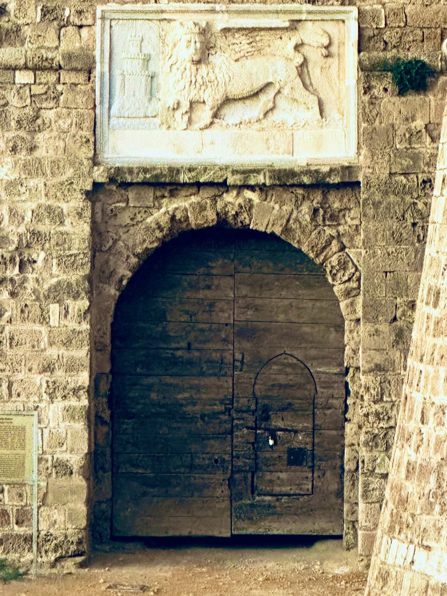 Old fortress door beneath an archway guarded by the Venetian winged lion emblem of St Mark at Othello’s Castle 🏰 #history #art #culture 

#mobilephotography 📸 #Archaeology #famagusta #cyprus 🕊️ #travel