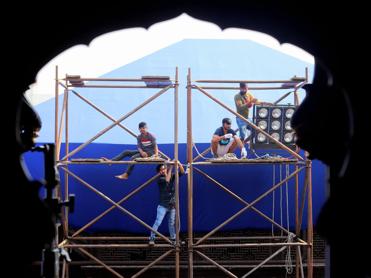 DevHardikar's tweet photo. some shots from my time on a Marathi film set - hauled a huge light to the top of four stories of scaffolding to simulate a sunrise https://t.co/6eYv8XEVzL