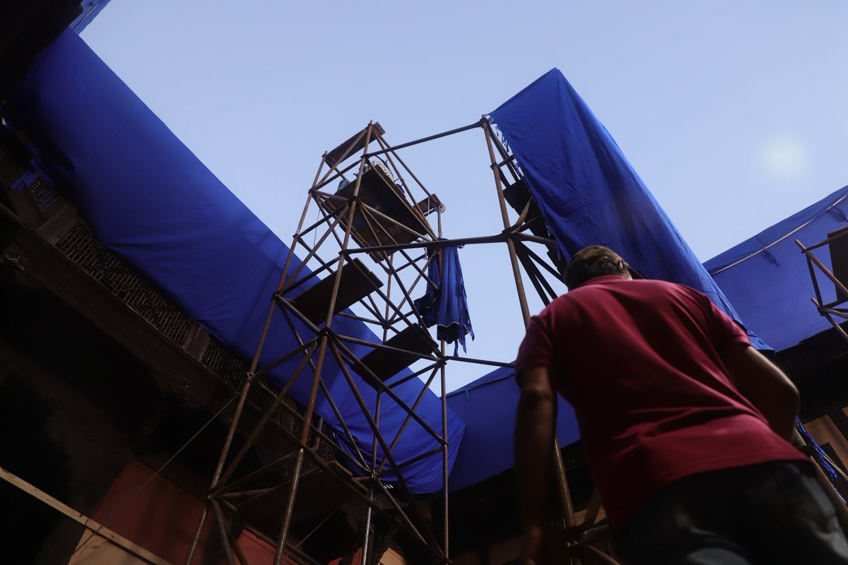DevHardikar's tweet photo. some shots from my time on a Marathi film set - hauled a huge light to the top of four stories of scaffolding to simulate a sunrise https://t.co/6eYv8XEVzL