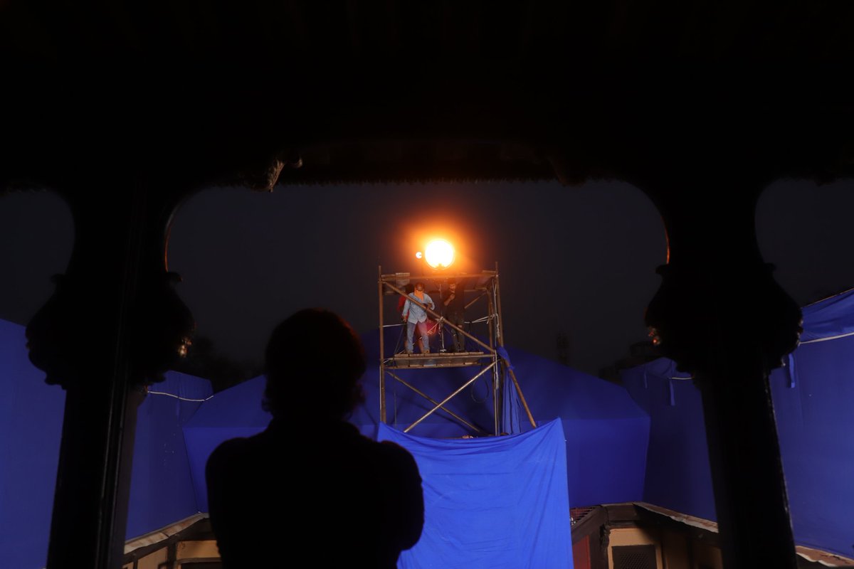 DevHardikar's tweet photo. some shots from my time on a Marathi film set - hauled a huge light to the top of four stories of scaffolding to simulate a sunrise https://t.co/6eYv8XEVzL