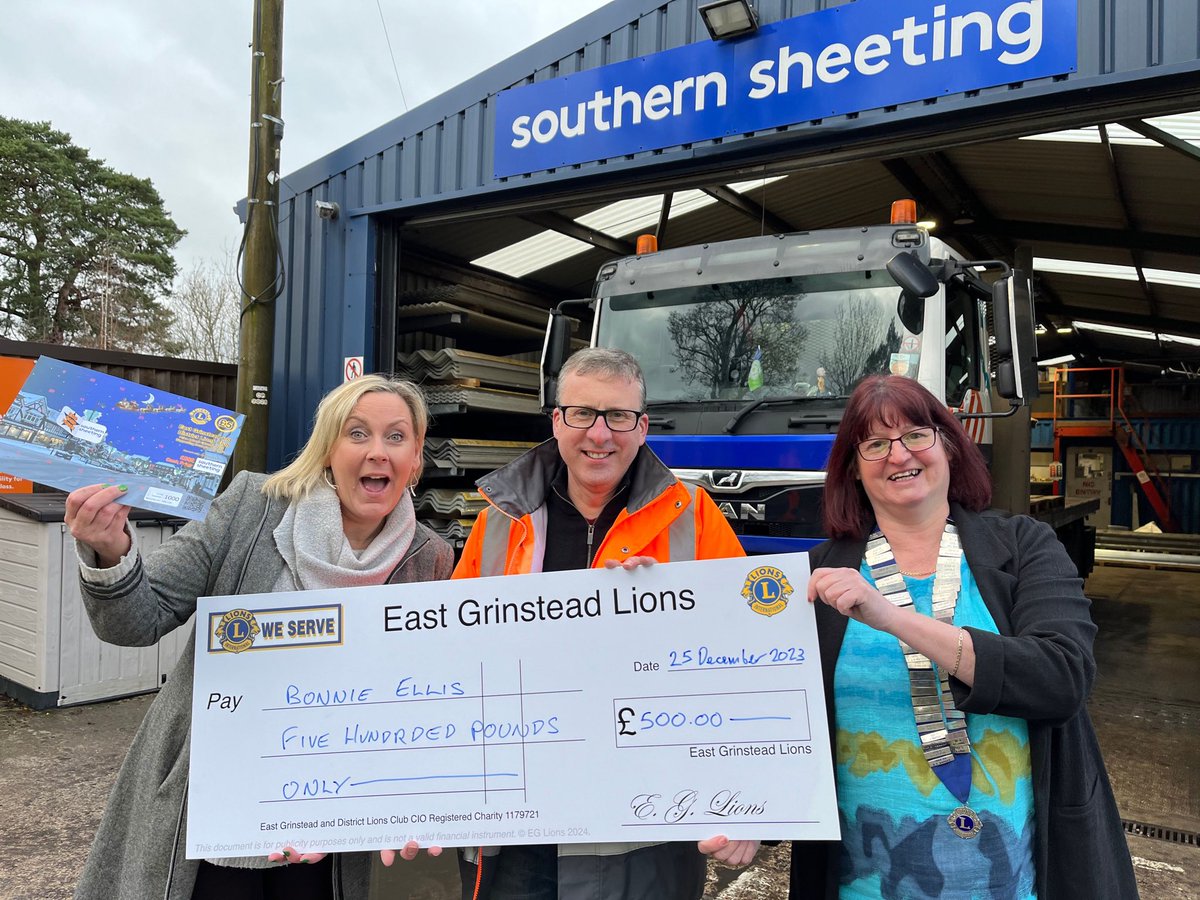 Star Prize winner of the Lions Advent calendar receives her £500 cheque donated by Southern Sheeting.