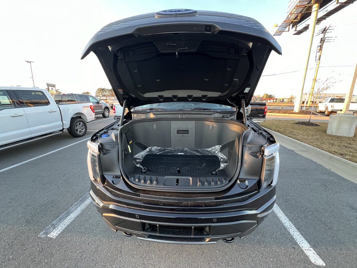theseabass02's tweet photo. Got to get my first look at the F150 Lightning’s front trunk IRL… holy cow that thing is huge. I haven’t seen the #Cybertruck frunk in person, but in pictures it looks way smaller than this. https://t.co/E3HYb3yyfn