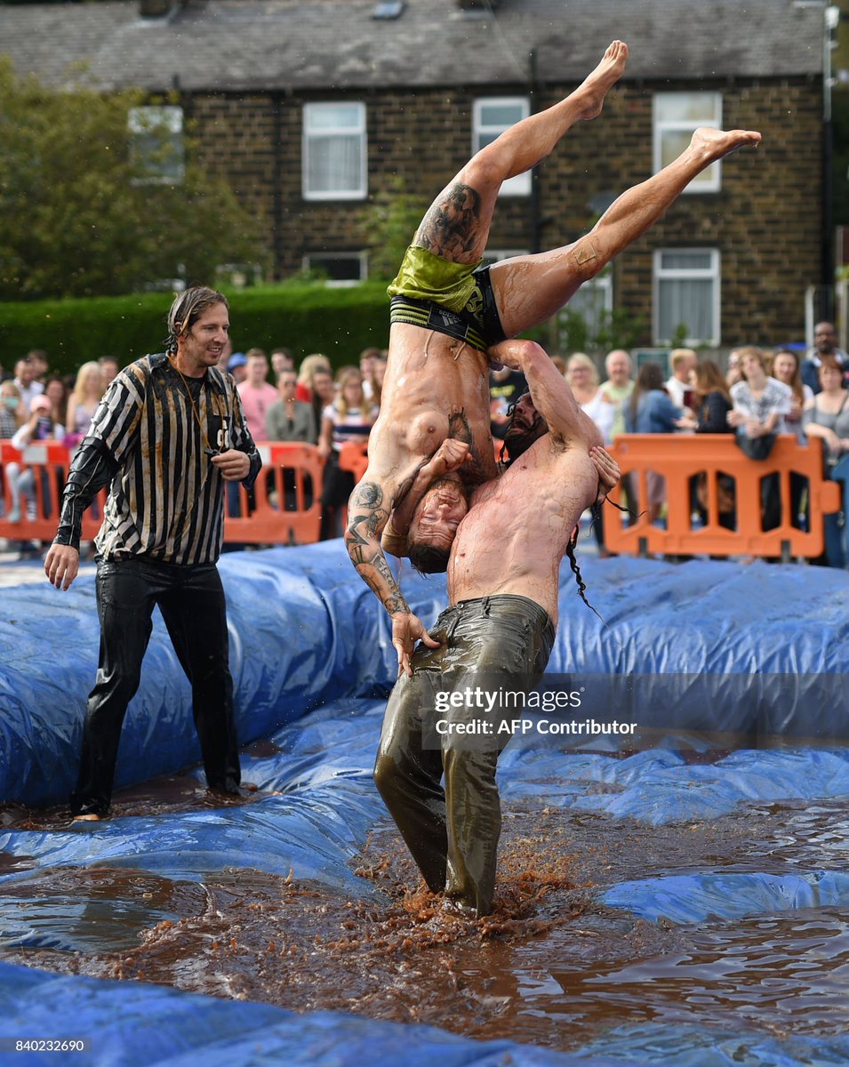 Competitors take part in the 10th annual World Gravy Wrestling Championships held at the Rose 'n' Bowl Pub near Bacup, north west England (2017)