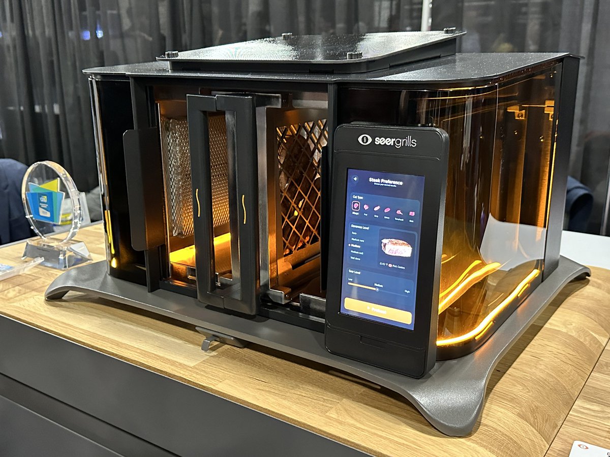 ThatsITLA's tweet photo. The Perfecta is an AI powered outdoor grill from @seergrills . Unlike other grills this one cooks vertically using a holder that slides into the grill. Pizza has a flat pan attachment. @CES #seergrills #CES #CES2024 #perfecta #grilling #Aitech https://t.co/bBZUTDzSEC