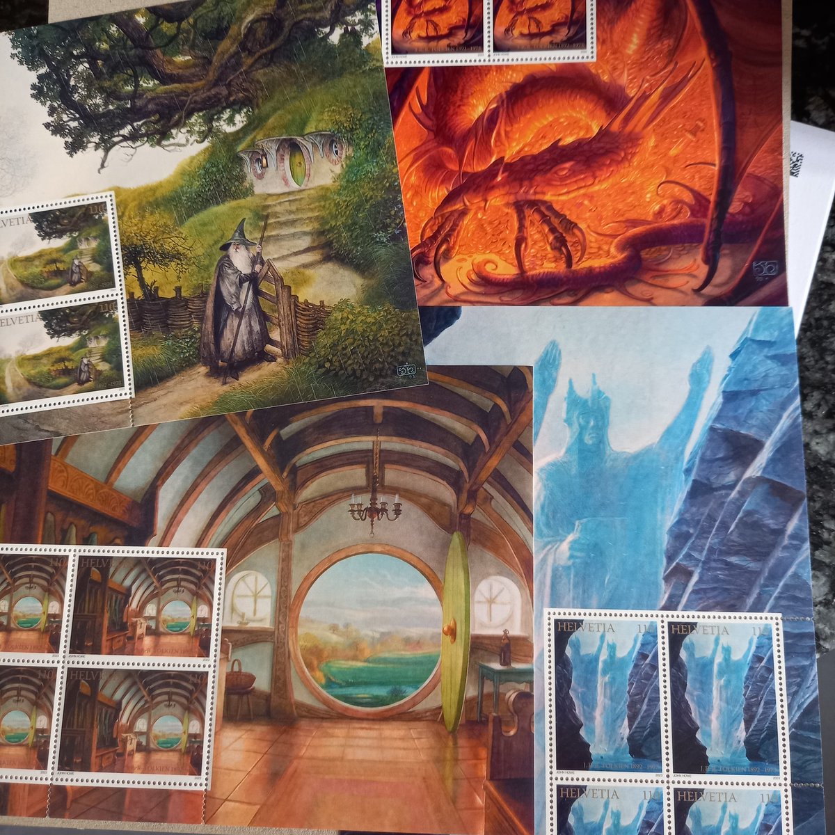 DenizBevan's tweet image. #Tolkien goodies!
#BeyondBree calendar @khorazir and
#JohnHowe stamps #Switzerland🇨🇭