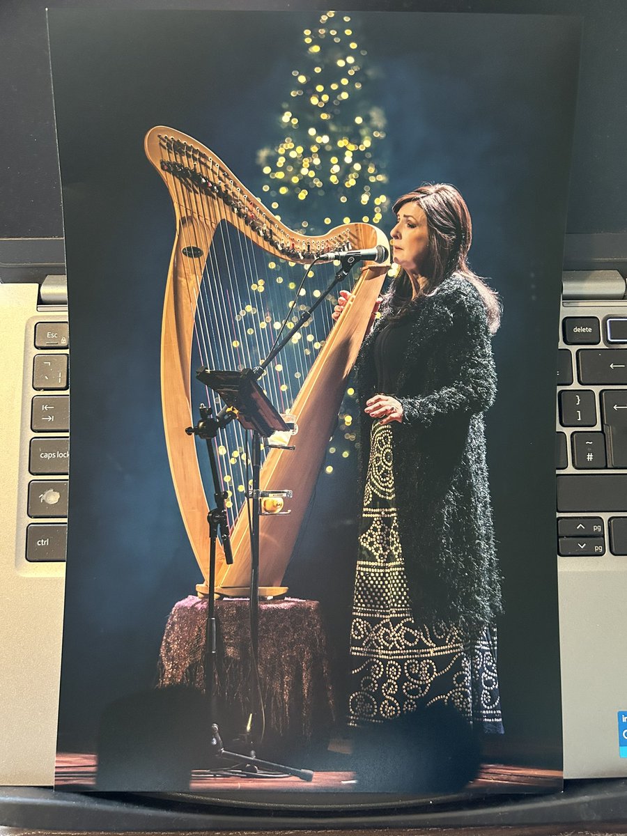 Such a stunning photo of @moyaclannad  at her recent Christmas shows in the Netherlands. This photo was taken by @PetervanHeun I loved it so much I had to have my own copy 🥰 Thank You Peter 😊