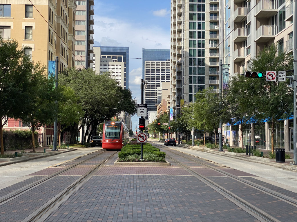 VALUE URBAN DESIGN. Main Street was transformed by rail — 6 traffic lanes to 2, with wider sidewalks and new landscaping. It became a much better place, not just a better transit line.