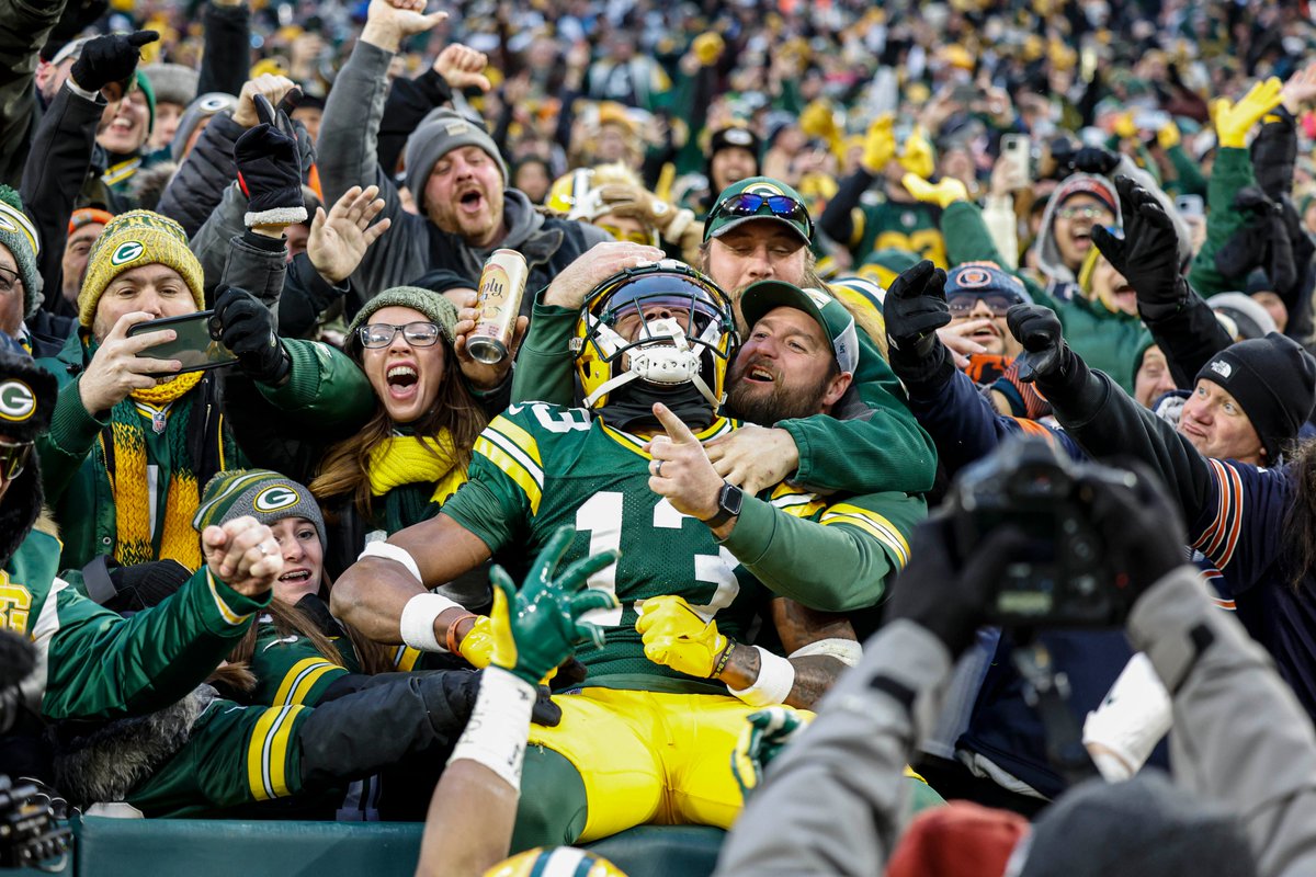 John_Shifflett's tweet photo. Incredible AP photo of former #UVa star Dontayvion Wicks looking up to the sky after scoring the first of his two TDs in the Packers' win over the Bears on Sunday. His performance came on former teammate Lavel Davis Jr.'s birthday. This photo will be in Tuesday's @DailyProgress. https://t.co/6txu1laiYA