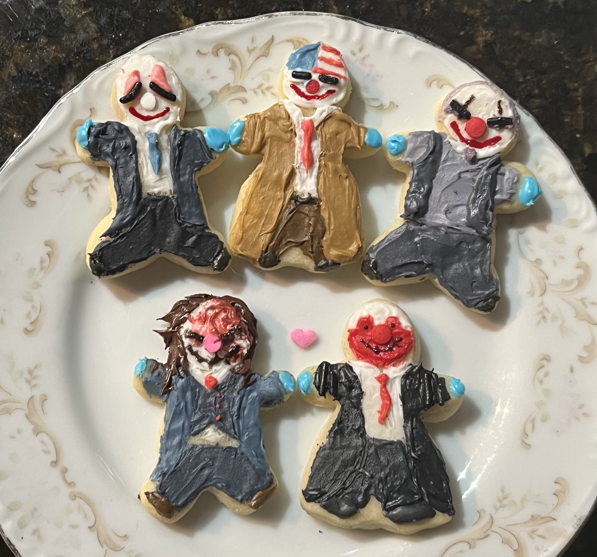 ROCKANDTUMBLE1's tweet photo. we made another batch of cookies last night  so i decided to make some silly little clown guys @PAYDAYGame #PAYDAY3 https://t.co/iNyJ3GfHoo