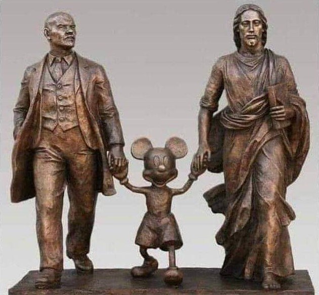 Sculpture of Lenin, Jesus and Mickey Mouse?
Maybe it's supposed to be a statement about politics, religion and culture walking hand-in-hand, if that's who they are, but maybe they want to make this co-parenting thing work as they take their child to its first day of kindergarten.