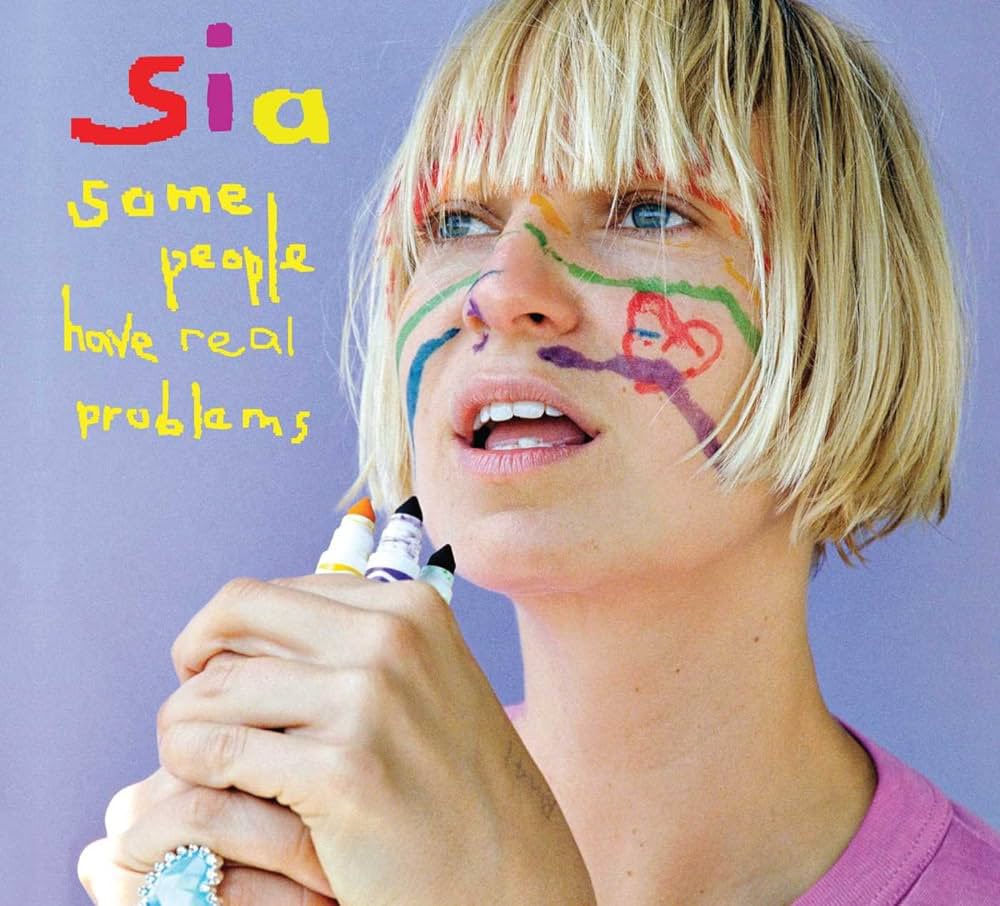 Sia's tweet photo. A very happy sweet sixteen to 'Some People Have REAL Problems' 🎂 https://t.co/BuHM4bmSXp - Team Sia https://t.co/lJUFL0Z7z9