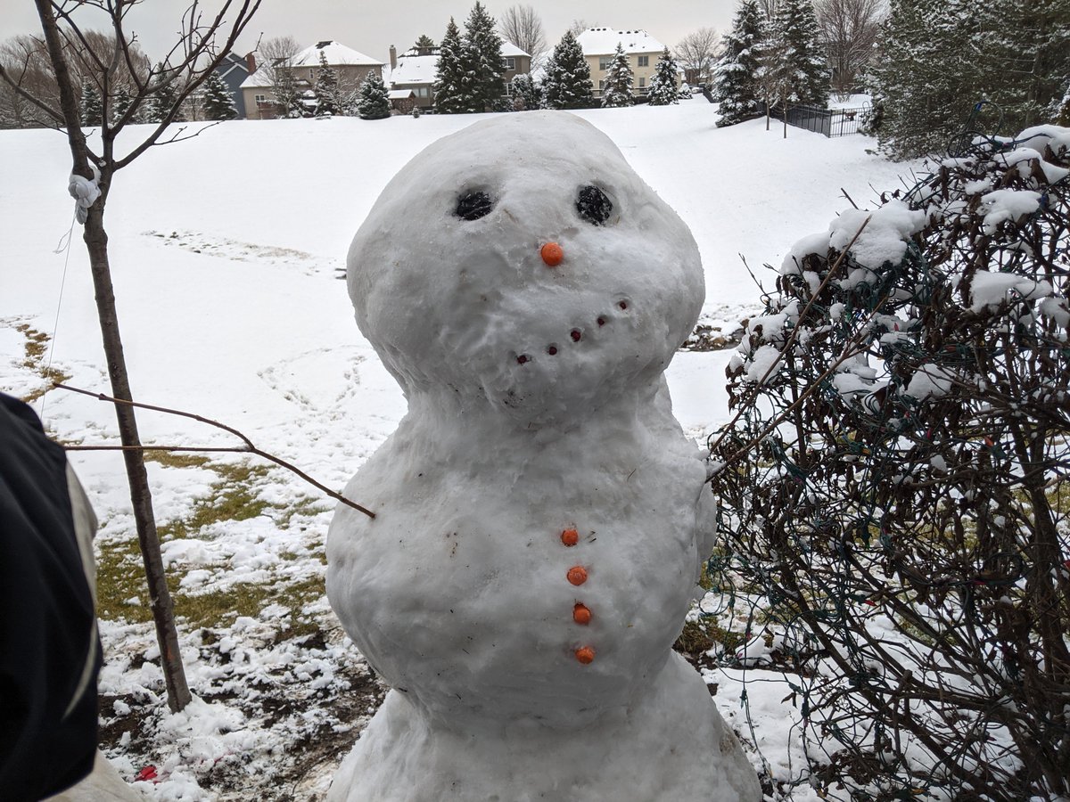 IronManRust's tweet image. The thus far mostly snow-less #Chicago #winter relented yesterday and my wife, son and I finally got our first chance to build a #snowman this season. I present to you #HappyTheSnowman, complete with a contemplative expression, per my 3-year-old's request.