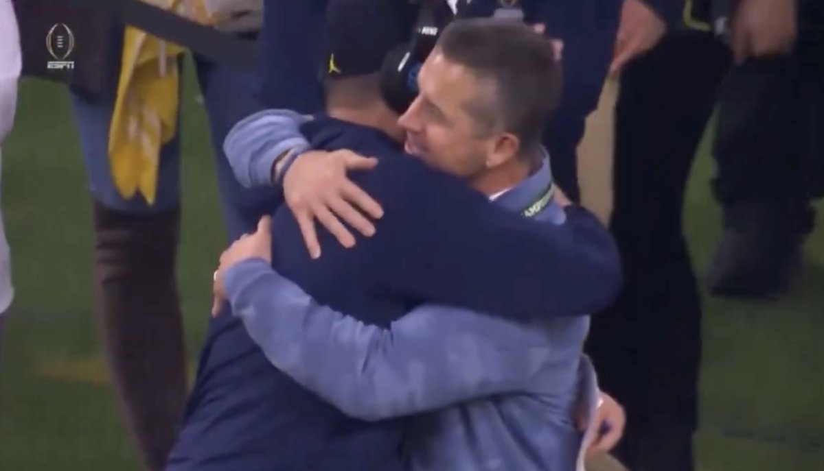 Ravens's tweet image. The Harbaughs. 

Coach made it to the national championship. 💜