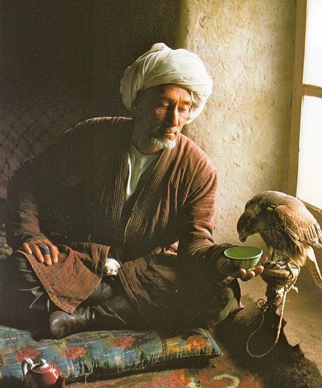 Man in traditional Central Asian attire with his falcon. Wakhan Corridor, Khorasan´s Badakhshan province. Roland and Sabrina Michaud, 1983.