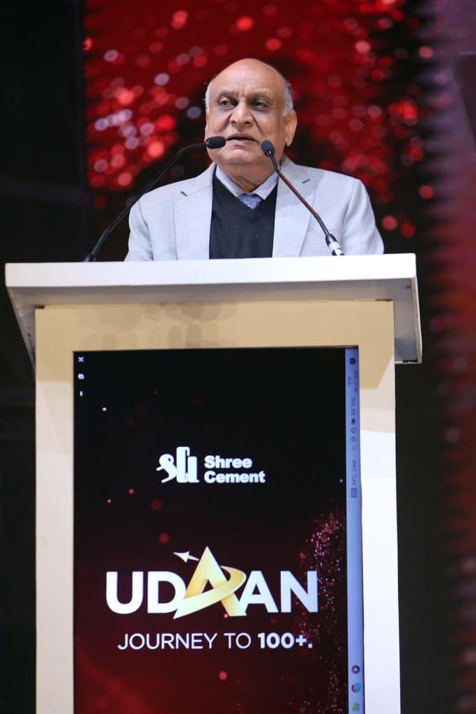 shreecementltd's tweet photo. Our Chairman Shri HM Bangur addressing more than 8000 Bangur family members at Udaan on 4th Jan, 2024 said:
“The remarkable journey of more than four decades of Shree Cement resonates resilience, innovation and trust. As we march ahead with the new brand identity under the unifying banner of the Master Brand Bangur, we remain committed to grow big, grow fast and grow large.
As we usher into 2024, Shree Cement unveils a pivotal announcement, affirming our dedication to innovation and progressive expansion. "Build Smart" stands as our new guiding principle, encapsulating a vision that heralds a future characterized by brilliance and togetherness.
Setting our sights on a monumental goal of surpassing 100 million tons by 2030, this aspiration underscores our belief in the potential and prominence of the Bangur brand. More than a mere numerical target, it symbolizes a legacy steeped in trust, innovation, and an enduring commitment to fostering a sustainable and environmentally conscious India.”

#BuildSmartWithBangur #SustainabilityWithBangur #BuildSmart 
#ShreeCement #NewBrandIdentity