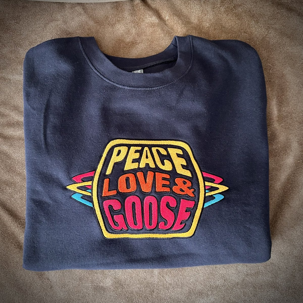 phandesignz's tweet photo. New, fully embroidered design - Peace, Love & Goose - galactic loops. High quality Cotton Heritage brand sweatshirts. 5 colors, all sizes. In the shop - https://t.co/QQbhOdehyt
#goose #goosetheband #elgooseminimall #goosetour #phandesignz https://t.co/kKqkfDFnBe