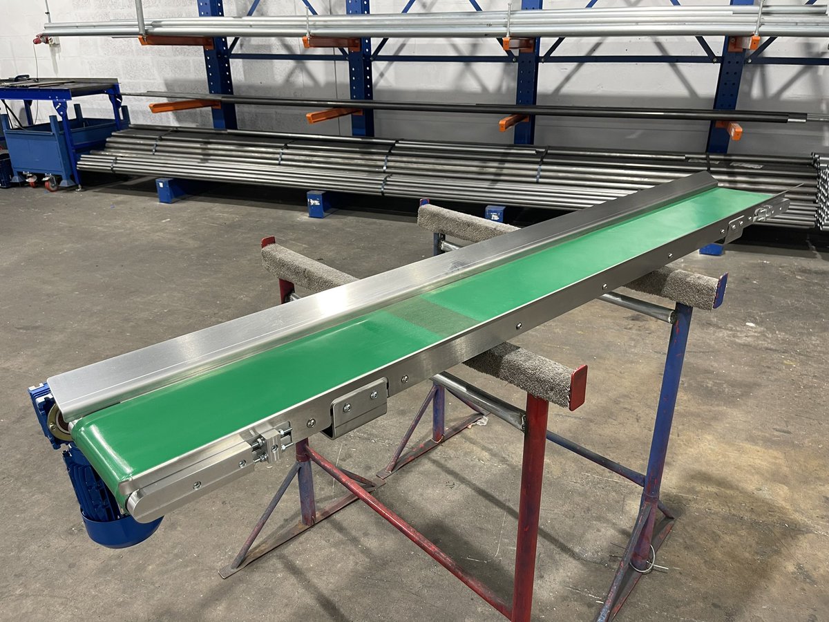 KCB40 #beltconveyor this unit was built with custom stainless guards and inverted feet to fit inside a low level press tool to exit scrap slugs. #pressconveyors #machineconveyors conveyorsections.co.uk/belt-conveyor/