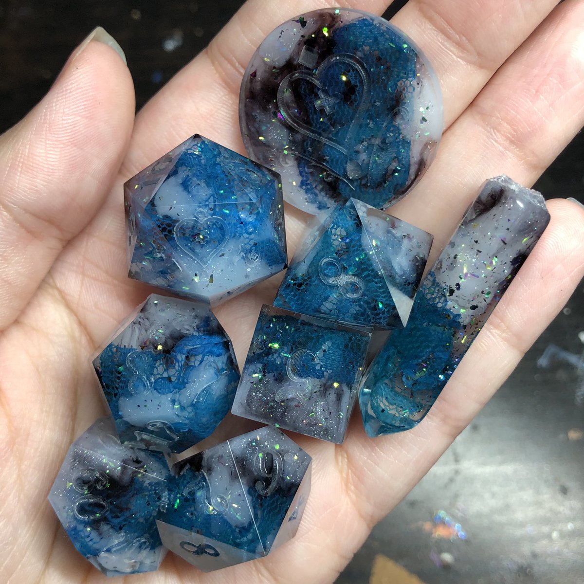 HealersHug's tweet photo. .This set came out beautifully, only one little bubble in the d6 that can be patched easily. I absolutely love how the blue green lace looks in this set. 

#handmadedice #dice #diceset #dnd #dungeonsanddragons #ttrpg #dicemaking #dicegoblin #dicemaker https://t.co/KlVujEkMow