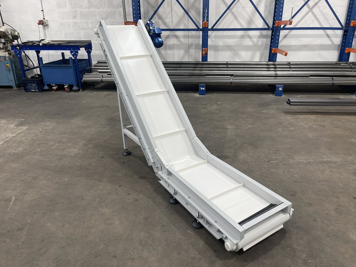 TYPE 2 #incline #beltconveyor used for handling machine off cuts. #conveyors built to order in custom sizes, with a range of belts and guarding types available conveyorsections.co.uk