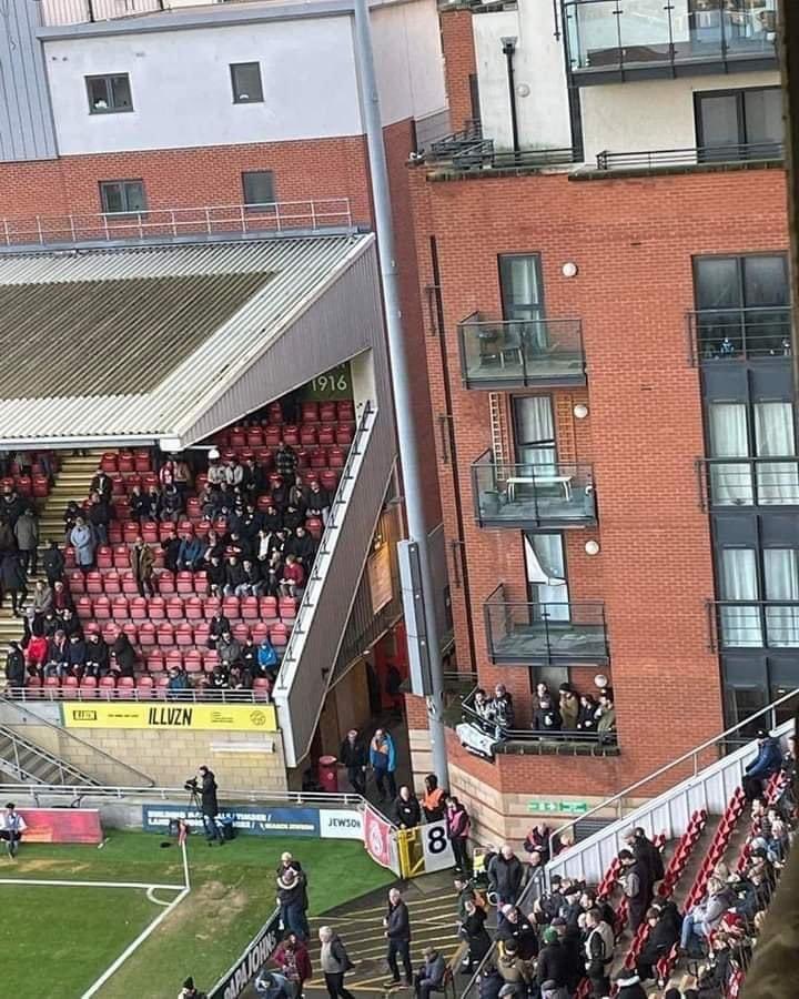TVNewsCaps100's tweet photo. Six Derby County fans after travelling to attend their League One away clash with Leyton Orient, were deprived of away tickets.
One of these 6 lads knew one of the tenants in the flat with a balcony facing inside Brisbane Road so they watched the game from there! 
#DCFC ⚽️⚽️⚽️ https://t.co/RLv69N0B0X