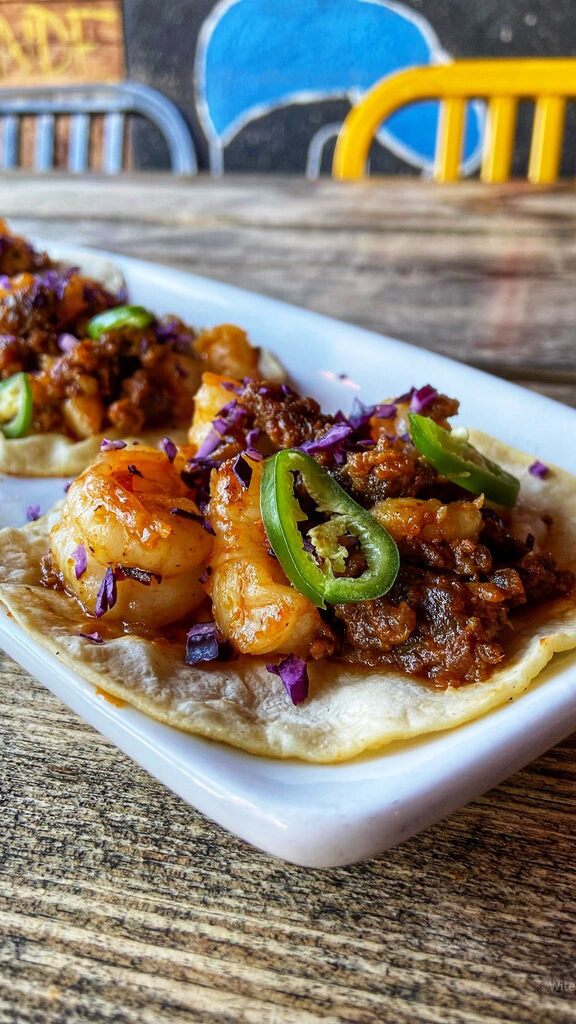 Back by popular demand: Shrimp and Grits Taco del Chef. 

Delicious shrimp, Mexican chorizo and minced serrano peppers, sitting on top of a corn tortilla and our homemade corn poblano salsa grits. Garnished with red cabbage and sliced serrano peppers. Watch #Instavideo:https…