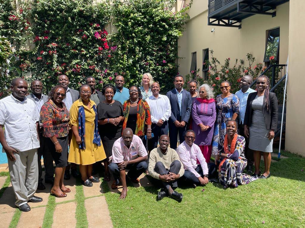 Organizing team meeting for conference preparations.