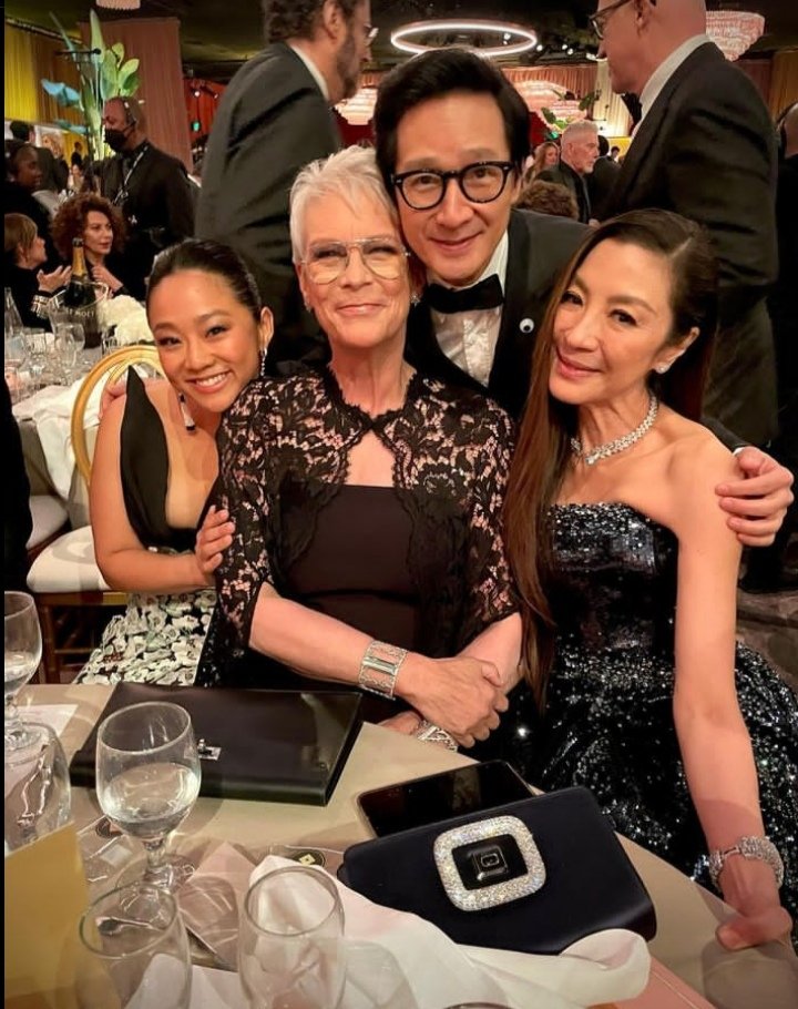 thinking about how in both of these photos the light above ke huy quan's head is so perfectly aligned that it looks like an angel's halo.