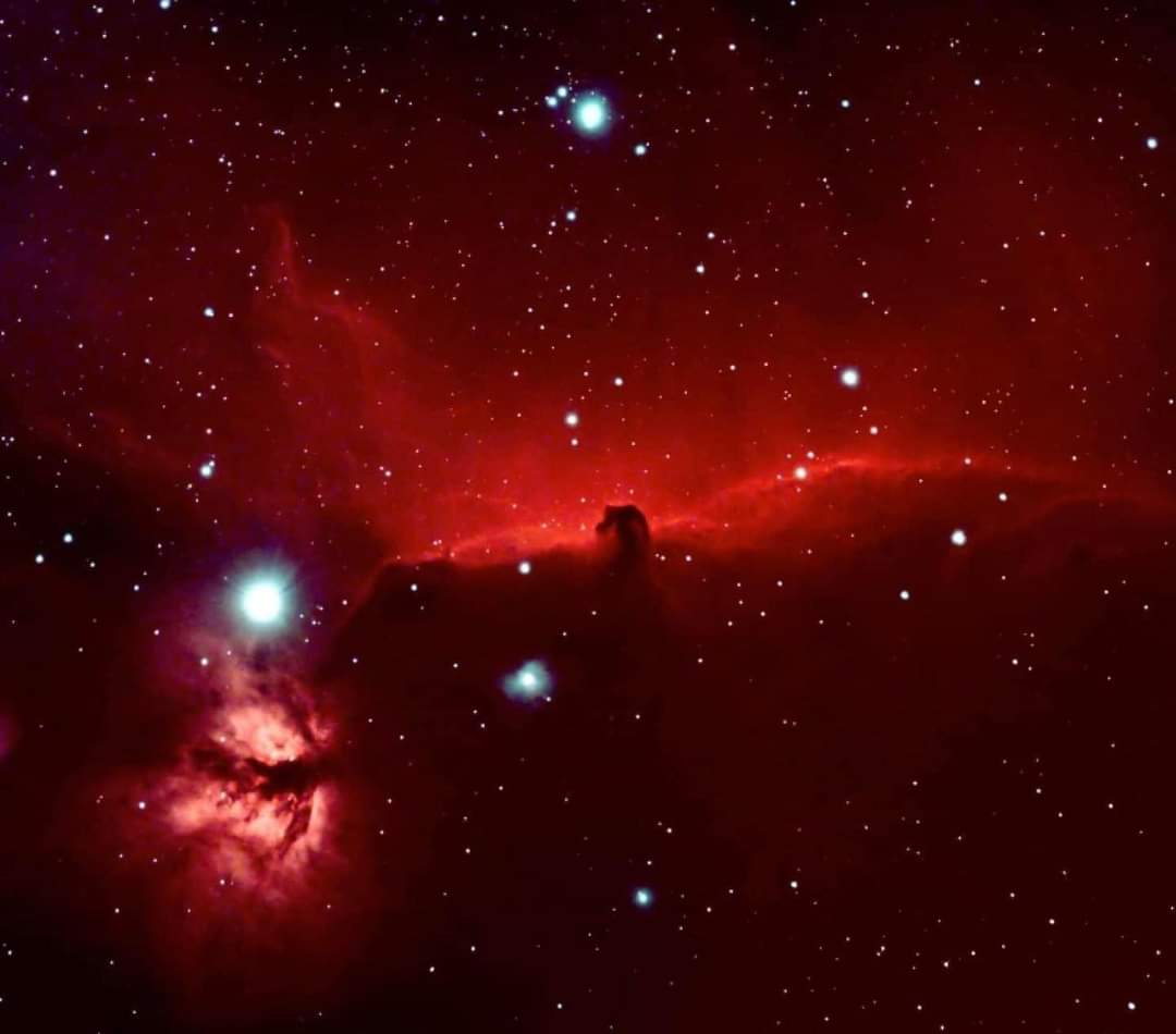 The Horsehead Nebula, designated as Barnard 33 (B33), is a dark nebula located in the constellation Orion. It's one of the most recognizable nebulae, known for its distinct silhouette that resembles the profile of a horse's head against a backdrop of bright emission nebula,