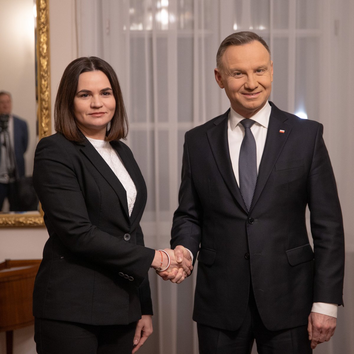 Tsihanouskaya's tweet photo. I am immensely thankful for the strong friendship that connects us with 🇵🇱 #Poland. Today, President @AndrzejDuda assured me of unwavering Polish support for the Belarusian democratic movement.

We discussed the situation in #Belarus & #Ukraine, strategies to confront Russia's aggressive policies towards Belarusians & our joint efforts in the @UN. 

Later tonight, we co-hosted a reception for Belarusian civil society in #Warsaw. 

On behalf of the Belarusian people, I had the honor of awarding President Duda with the Cross of Good Neighborhood.