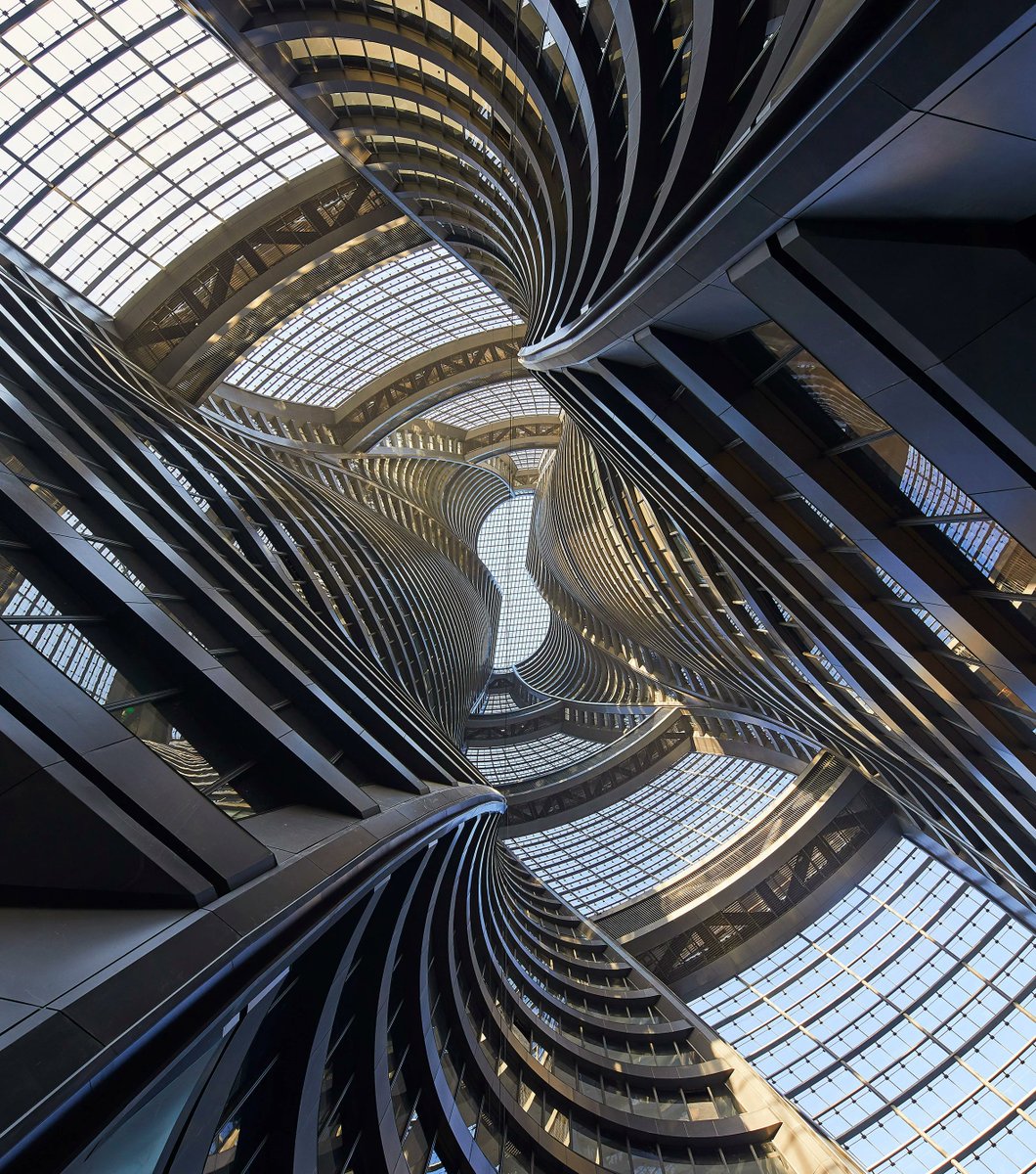 shailaputra's tweet photo. Zaha Hadid's Leeza SOHO in Beijing twists to the sky, defying gravity & flooding its heart with light. Sustainable marvel, vibrant hub, architectural icon. Must-see in #Beijing #architecturelover #futureofbuildings https://t.co/PtTKLhiDfB https://t.co/deEfvmZI4O