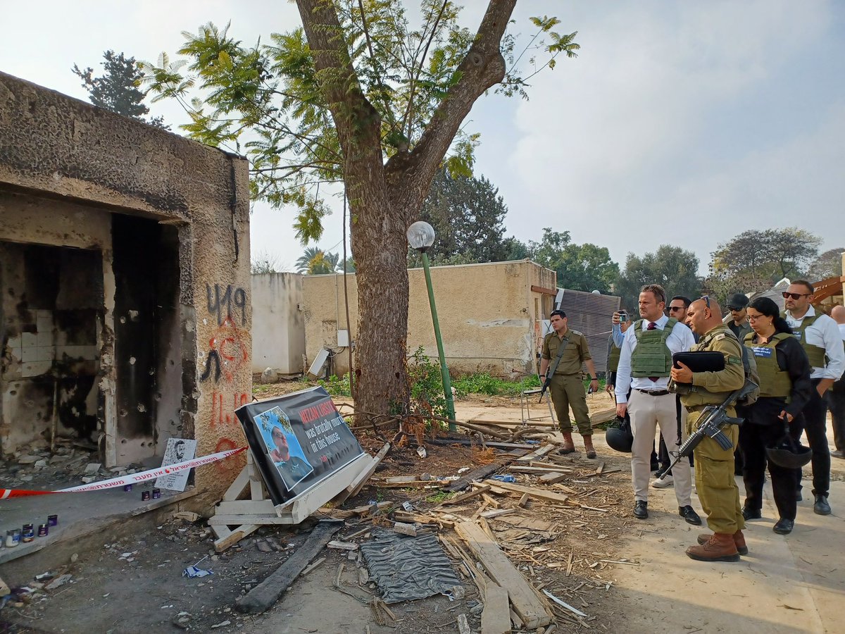 Xavier_Bettel's tweet photo. The scenes of desolation I saw, and the testimonies I heard, while visiting Kibbutz Kfar Aza where Hamas terrorists murdered and kidnapped dozens of people were deeply troubling. Nothing can justify these heinous acts. Hamas must immediately release the remaining hostages. https://t.co/cyZn17G9nV
