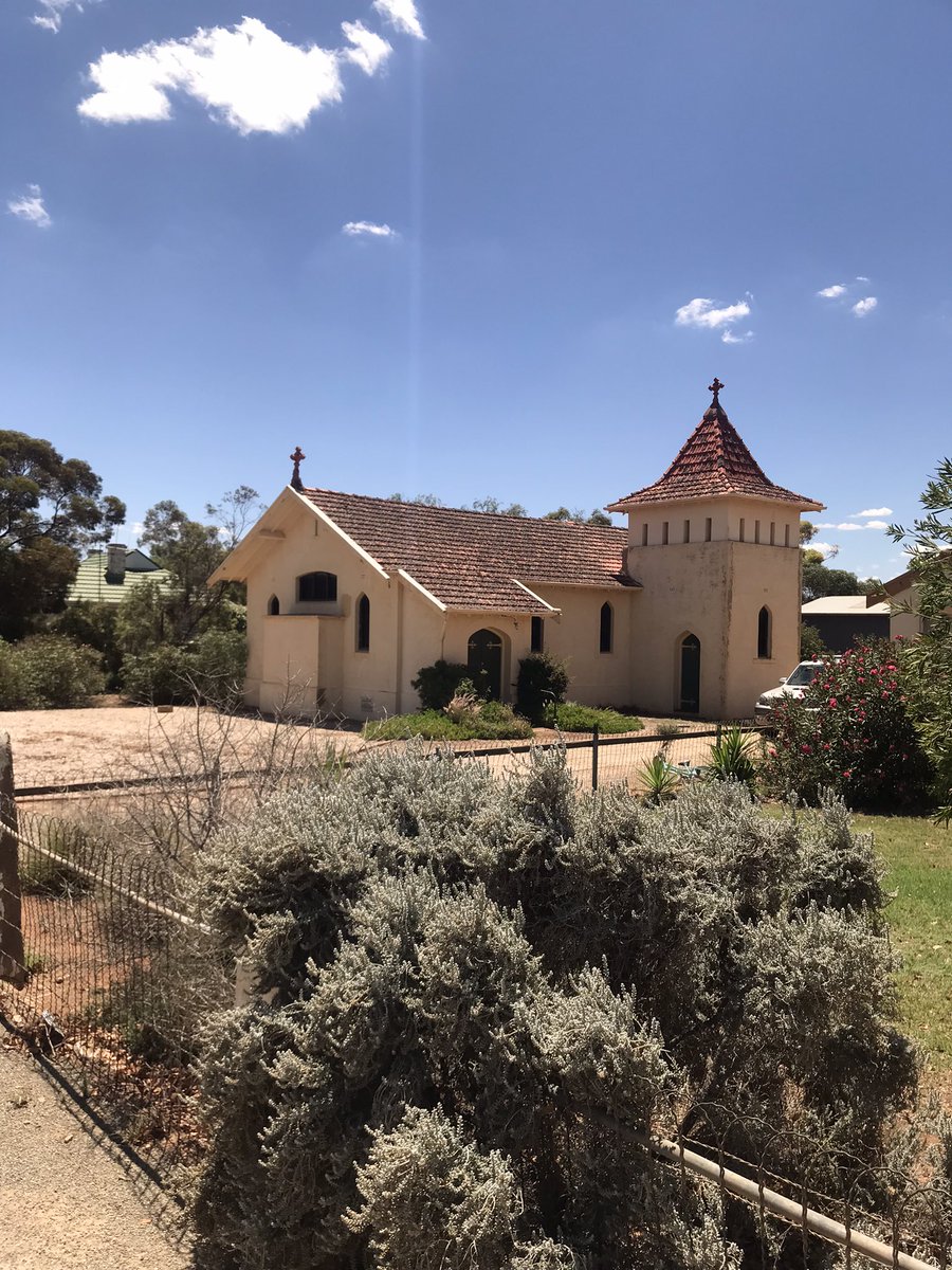 AustAnglican's tweet photo. Orroroo: population 516 (46 Anglicans, 8.9%). St Paul’s is the third Anglican church building in town; opened for worship by Bishop Gilbert White 27 June 1920. Very curious architecture: described as ‘gothic meets California bungalow’ or ‘strange Mediterranean style’ 😂 https://t.co/P7e66zdX9u