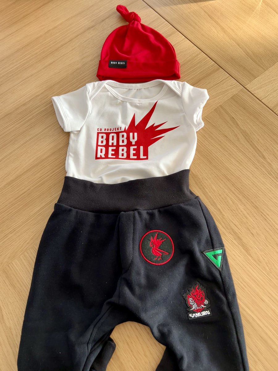 BartPyrko's tweet photo. Do you know what's great about @cdprojektred? Initiatives like this. 😍

Thank you @cdprojektred for these awesome gifts for new parents! ❤️❤️❤️

We're going to totally rebel with this baby! 😆
#REDS, Baby rebel designer is coming! 💪😀

#dadcontent #babyrebel #cdpr