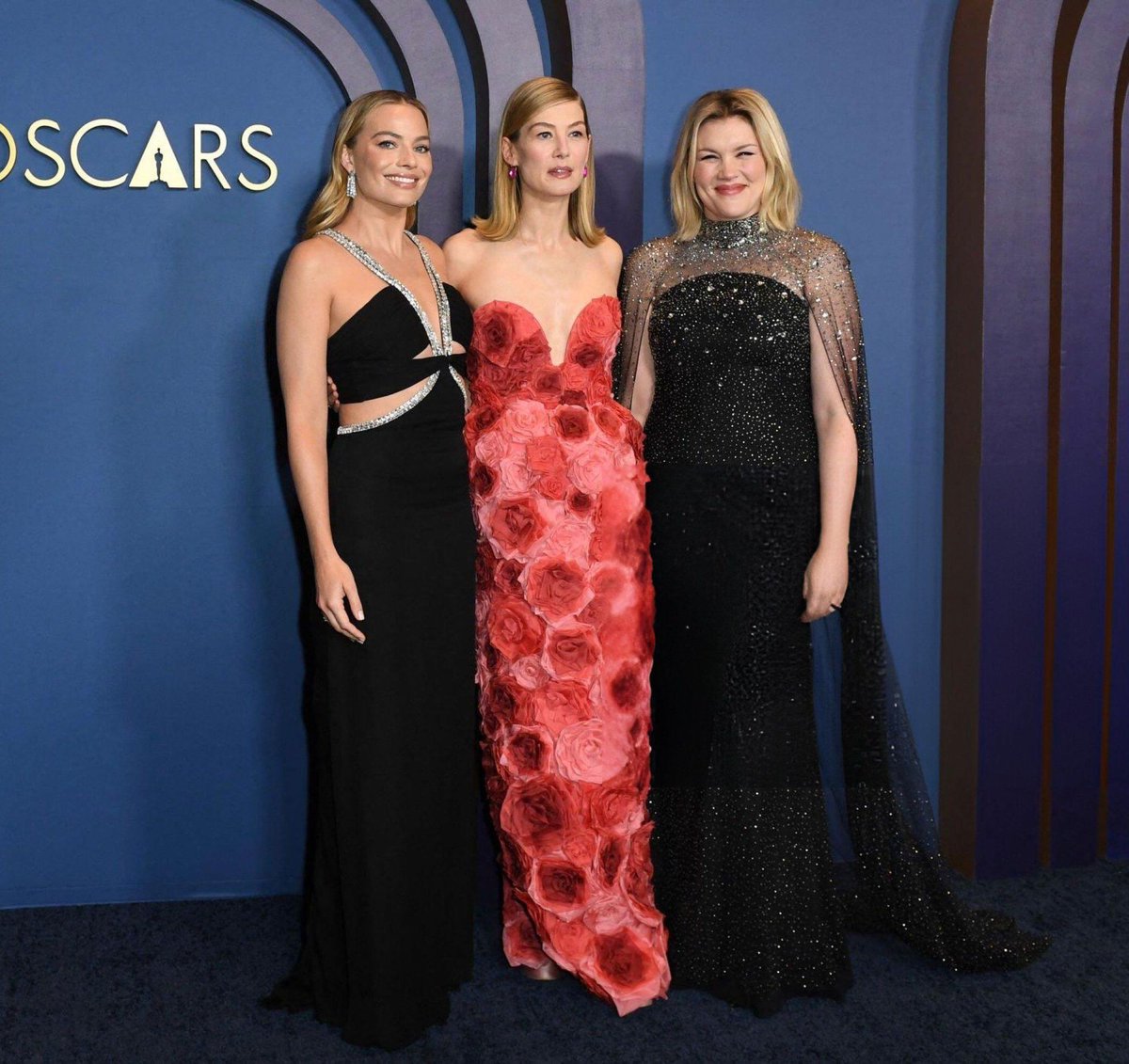 Emerald Fennell wearing Jenny Packham with Margot Robbie and Rosamund Pike at The Governors Awards in Los Angeles.