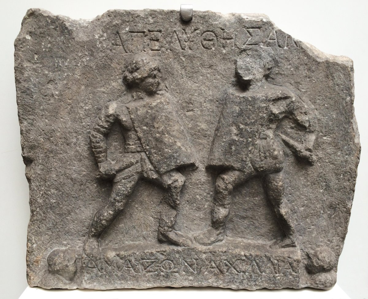 Relief of two female gladiators from the ancient city of Halicarnassus in Turkey (1-2th century AD). 
The battle scene of the Amazon and Achillian female gladiators is a clear reference to the mythological battle of Achilles and the Amazon Penthesilea.
#GreekMythology #Gladiators