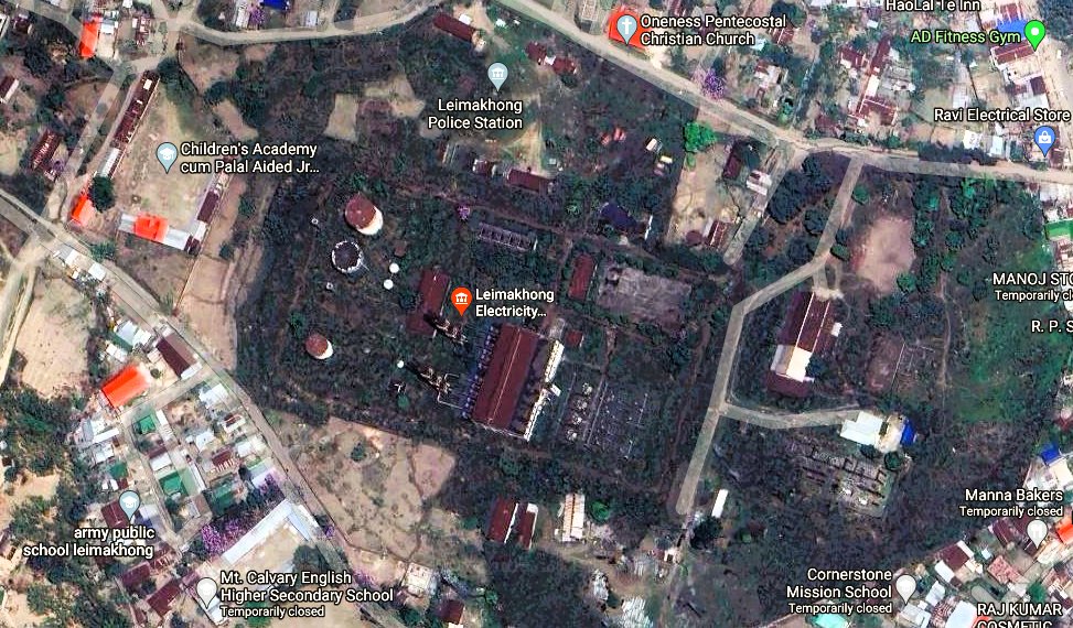 debanishachom's tweet photo. Some questions on the oil leak from Leimakhong’s defunct heavy fuel power project:

The nearest point from the river to the defunct power plant is 450 metres; the farthest (within Leimakhong) to the river is 2.5 km.

If the oil leak has to reach the river, it would have to pass through a crowded area - schools, churches, a small market, etc.

It is not known where the oil was stored, whether underground or in the tanks (visible on the map) which are in a state of disrepair. You can safely rule out a surface oil leak as the streets would have been ‘oiled’ by now.

An underground storage leak, however, would need a massive amount of oil to seep to the river. This dead power project had a few tanks of oil left, publicly available information shows.

How did the oil leak into the river would be a matter of investigation then. #Manipur #Leimakhong