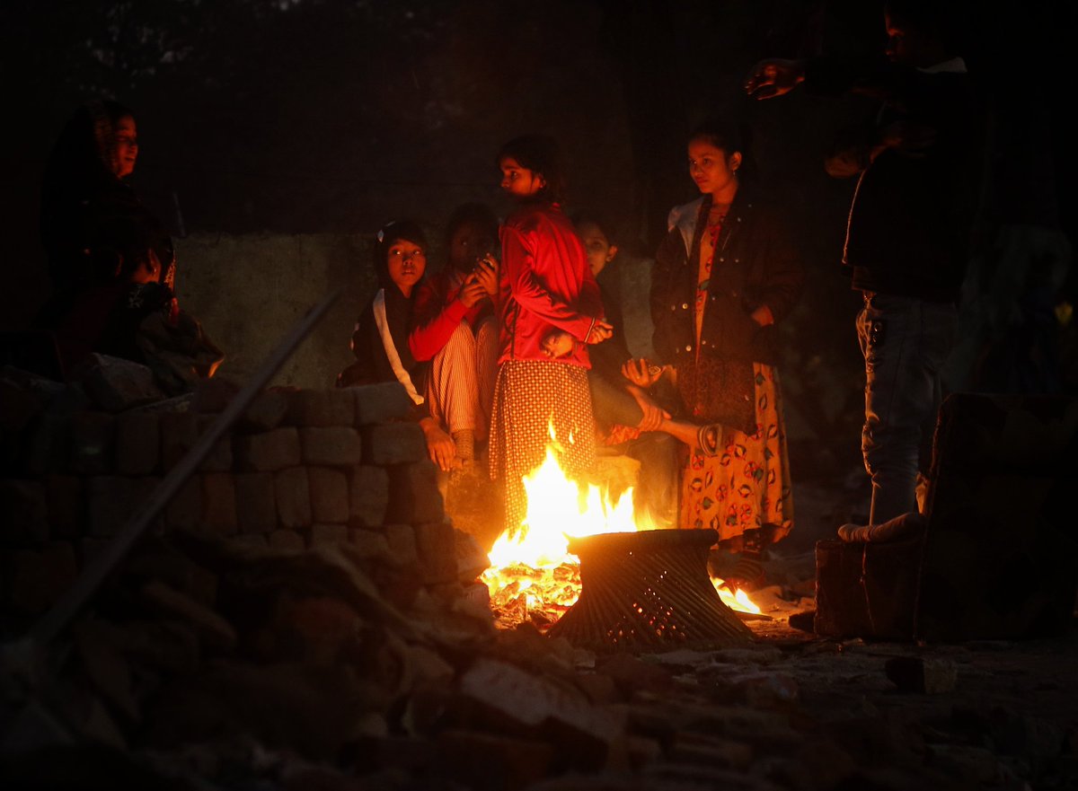 WasimSarvar's tweet photo. #Homeless people sit around a #Bonfire to #warm themselves on a #coldwinternight at #Mathuraroad #Nizamuddindemolishedarea, the roof over their heads #demolished amid the biting cold of December #antiencroachmentdrives over the last few weeks in new Delhi on Wed, Jan 10, 2024. https://t.co/yCcTG61JQz