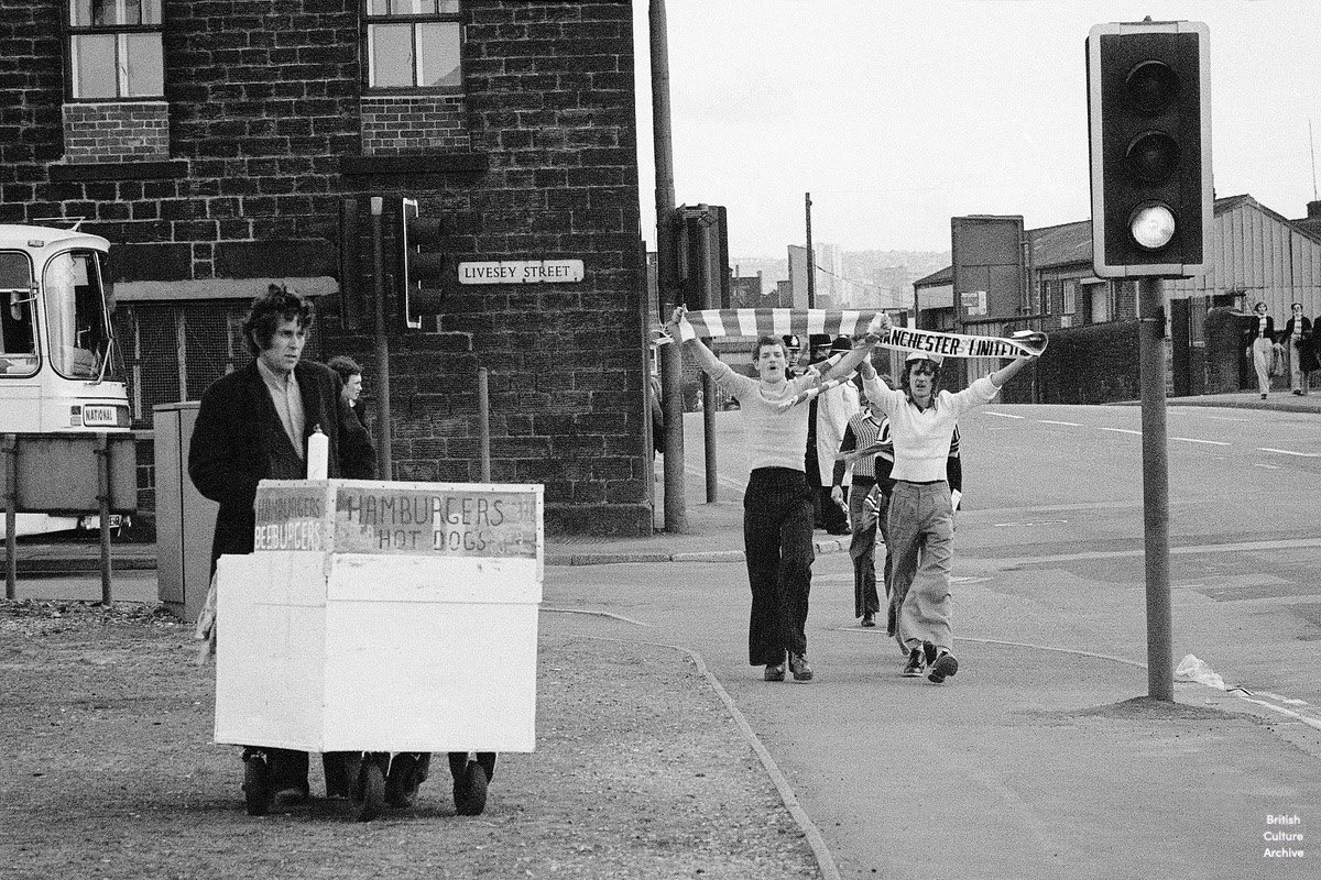 Manchester United fans arrive in Sheffield for the FA Cup Semi-Final against Leeds at Hillsborough, 1977. Photo © Peter Hill, all rights reserved.