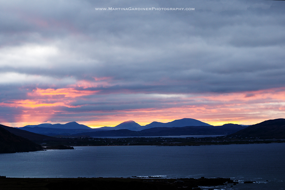 Sunset tonight from Knockamany Bends (near Malin Head) #Inishowen #Donegal. The view over the Isle of Doagh towards the Urris Hills