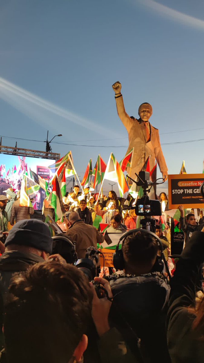 Abramjee's tweet photo. Scenes in Ramallah as Palestinians gather around the statue of Madiba ahead of SA’s case before the @CIJ_ICJ tomorrow. https://t.co/yIGz4Wtadb