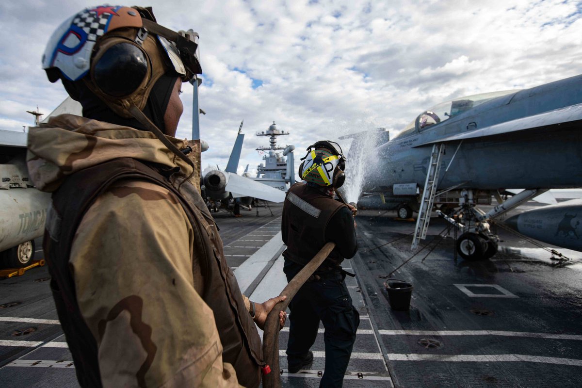 #Sailors assigned to the #Ragin’Bulls of Strike Fighter Squadron (VFA) 37 wash an F/A-18 Super Hornet on the flight deck, Nov. 27, 2023. #USSGeraldRFord #CVN78 #VFA-37 #CVW8 #USNavy