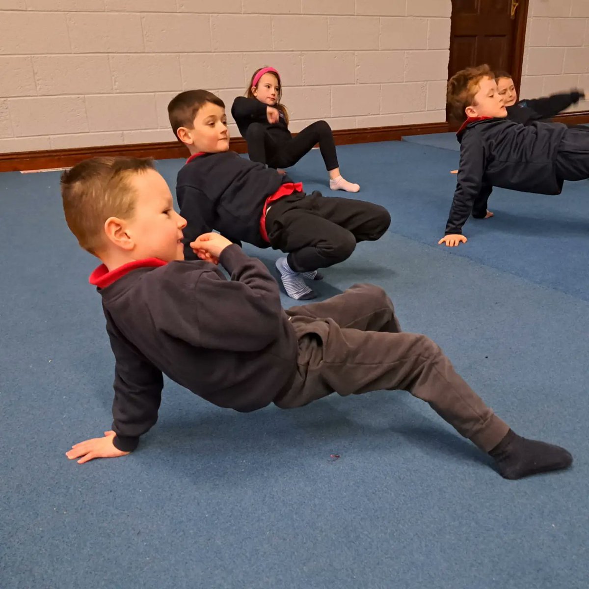The boys and girls enjoying gymnastics this morning with Kate from Fitness4Fun in <a href="/WilkinstownC/">Wilkinstown Community Centre</a>. How lucky are we to have such amazing amenities on our doorstep! <a href="/ActiveFlag/">Active School Flag</a> <a href="/PDSTie/">PDST</a> #gymnastics #localcommunity #schoolcommunity #activelearning