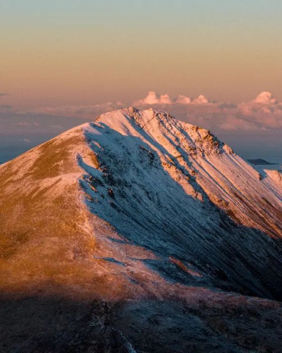 Scale the heights of Mount #Errigal and feel on top of the world 🥾🏔️ Put on your hiking boots and set off on the tallest mountain in County #Donegal! Tag your hiking buddy in the comments! 👇 📸 dronescapes_ireland [IG] #KeepDiscovering #WildAtlanticWay