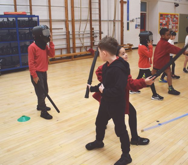 JBprimaryschool's tweet photo. Year Two had a fantastic time with #littlemusketeers this morning. Learning how to point, move and wear protective gear.   #johnburns #localschool #battersea #clapham #fencing #britishfencing #sportyschool https://t.co/V8NQQRCShb