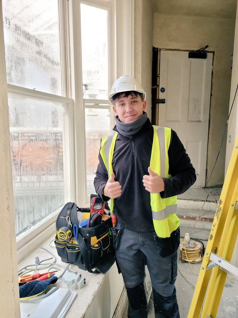 ArcadeNewport's tweet photo. Tarron Hood is one of several apprentices at the Market Arcade's restoration. Tarron is an apprentice electrician with Smallwood Electrical. #HeritageTreasures @HeritageFundCYM @HeritageFundUK 
#marketarcade @NewportCouncil #smallwoodelectrical https://t.co/8BEJBG4ewu