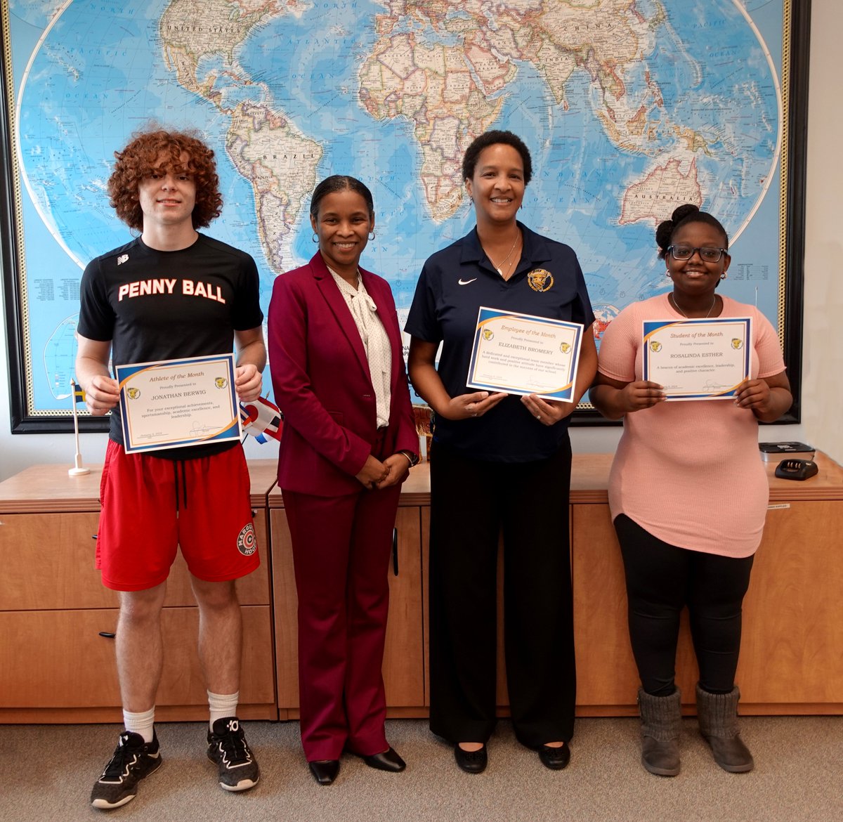 Golden Wall of January - Athlete of the Month, Jonathan Berwig; Student of the Month, Rosalind Esther; and Staff of the Month, Dr. Elizabeth Bromery.